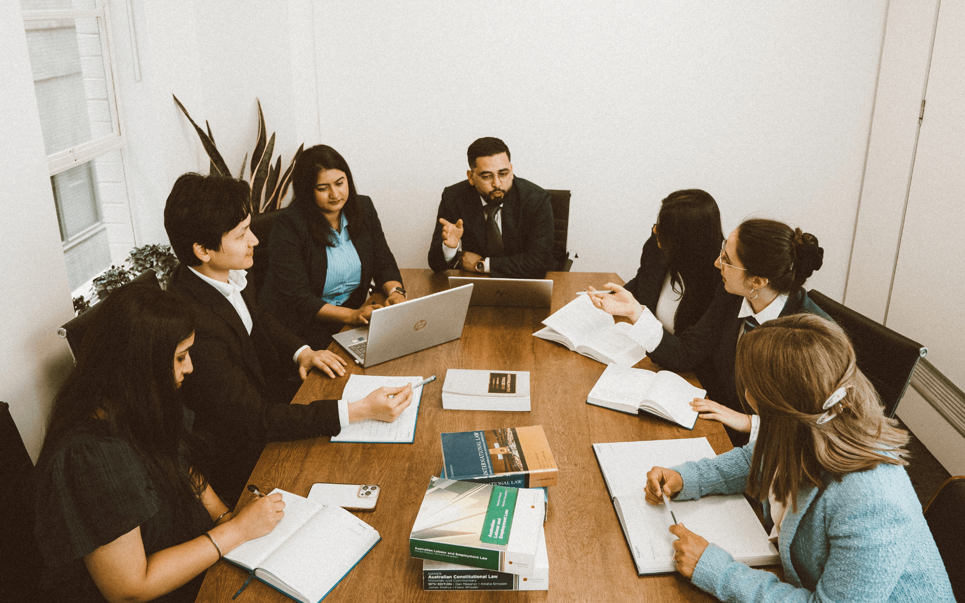 Placeholder for a candid photograph of legal research and submission preparation