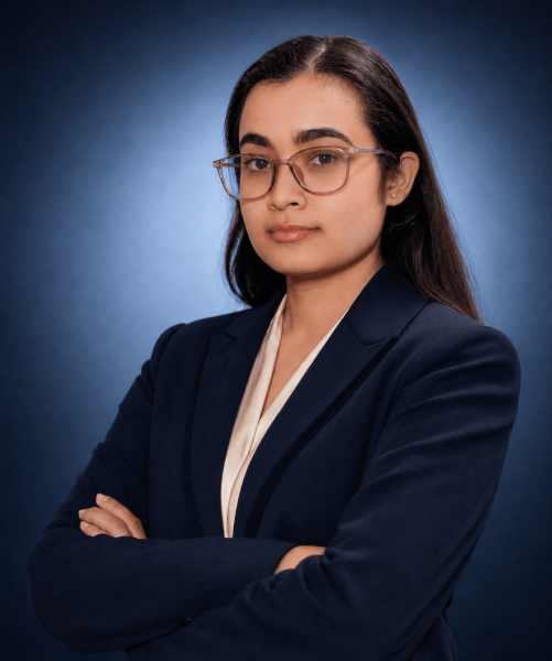 Rubita Dudharaj BK, Nepali Legal Officer at Emigrate Lawyers, in professional navy attire.