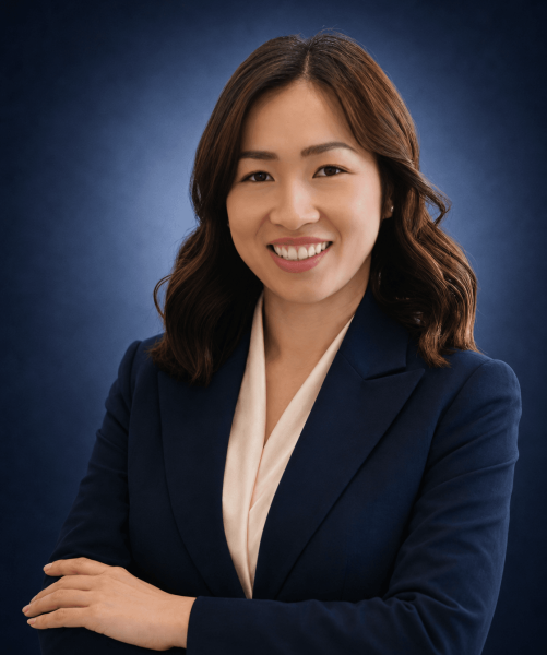 Michelle Nguyen, Consultant Conveyancer at Emigrate Lawyers, in professional navy attire.