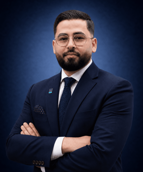 Madhab Kharel, Principal Lawyer at Emigrate Lawyers, in professional navy suit.