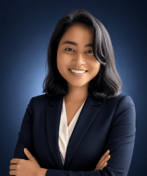 Anisa Zainudin, Paralegal at Emigrate Lawyers, in professional navy attire.