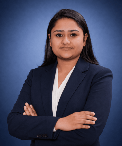 Kerusha Kharel, Marketing Officer at Emigrate Lawyers, in professional navy attire.