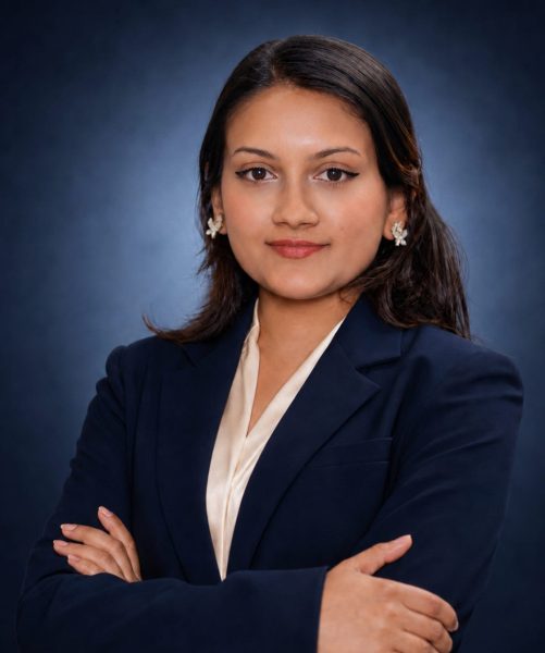 Bibishika Khanal, Legal Officer at Emigrate Lawyers, in professional navy attire.