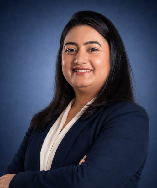 Shivani Thapaliya, Immigration Lawyer at Emigrate Lawyers, in professional navy attire.